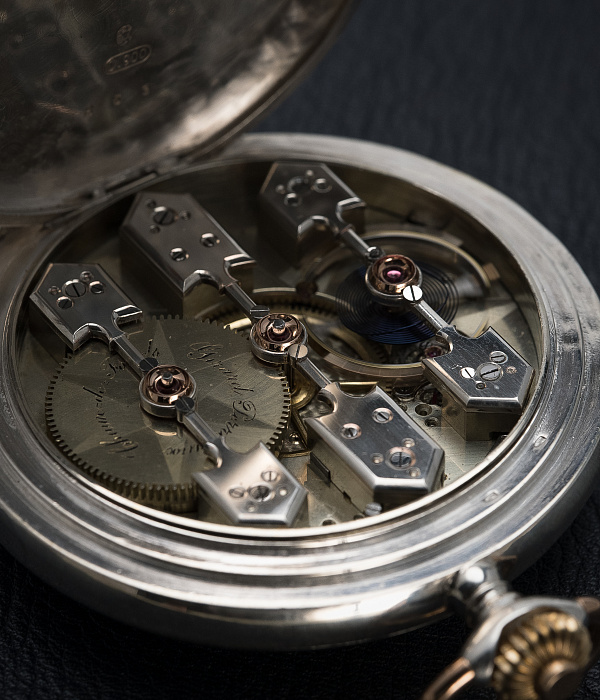 Silver Pocket Watch with a Triple Bridge Movement